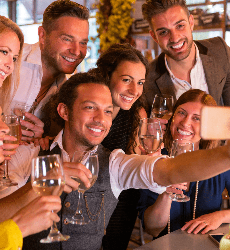 Friends taking a selfie during happy hour