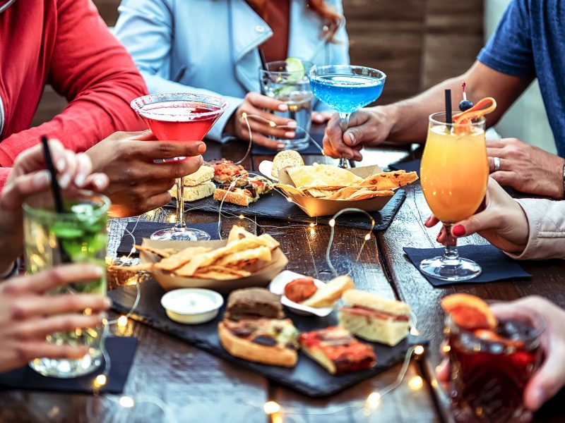 people enjoying different juices and food